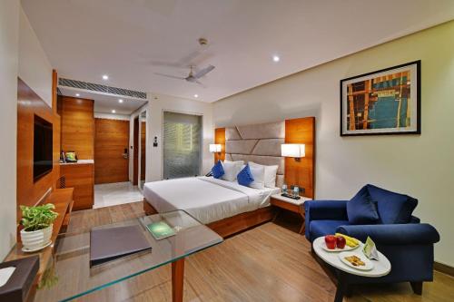 Tempat tidur dalam kamar di Hotel Atlantiis Suites Near Delhi Airport