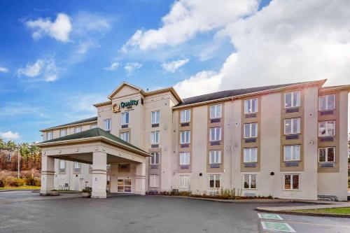 a rendering of a hotel with a parking lot at Quality Inn in Ottawa