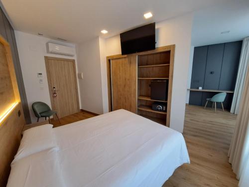 Cama ou camas em um quarto em Hotel Oca Insua Costa da Morte