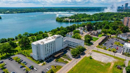 an aerial view of a building next to a river at DoubleTree by Hilton Hotel Niagara Falls New York in Niagara Falls