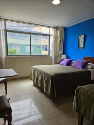 A bed or beds in a room at Hotel Acuario