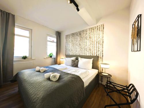 Una cama o camas en una habitación de BohnApartments - Topfmarkt XXL Suiten - NEU in TOP Zentrumslage, Vollausstattung, WLAN, Parkplätze