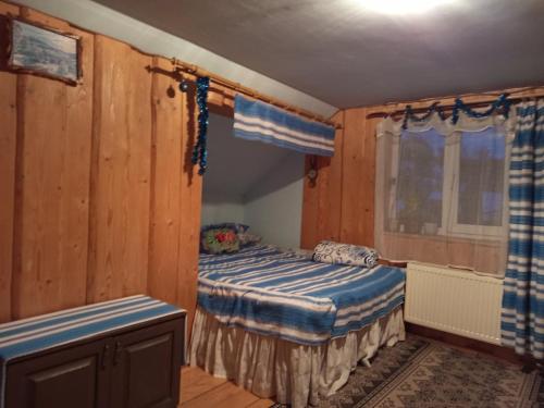 Una cama o camas en una habitación de Gostynnyi Dvir u Marichky