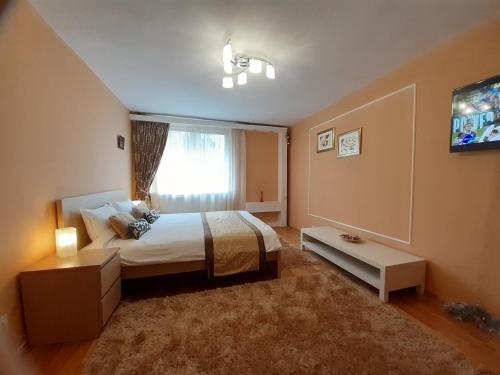 Ліжко або ліжка в номері Apartament Central