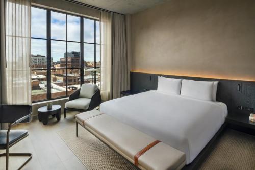 A bed or beds in a room at Nobu Hotel Chicago