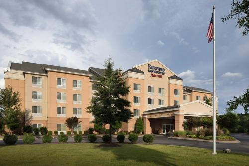 a hotel with an american flag in front of it at Fairfield Inn and Suites by Marriott Conway in Conway