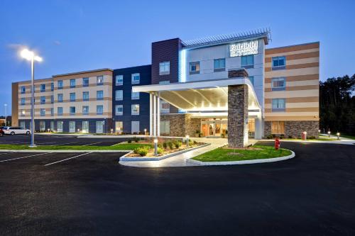 an empty parking lot in front of a hotel at Fairfield Inn & Suites by Marriott Plymouth in Plymouth