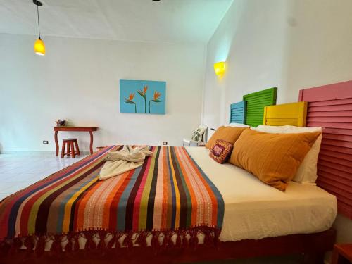 En eller flere senger på et rom på "Vainilla B&B" - Stylish Comfort in Playa del Carmen