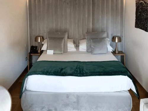 a bedroom with a large white bed in a room at La Residenza del Sole al Pantheon in Rome