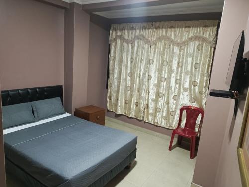 Tempat tidur dalam kamar di Hotel Caribe