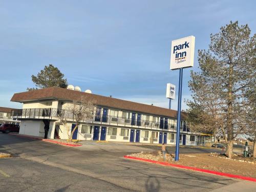 a building with a parking sign in front of it at Park Inn by Radisson, Fort Collins in Fort Collins