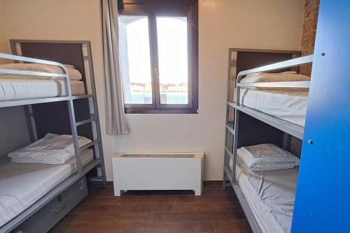 Tempat tidur dalam kamar di Generator Venice