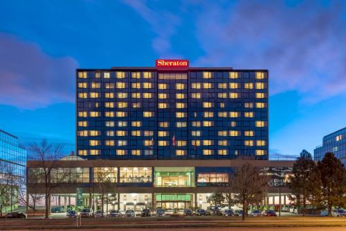 a hotel building with a sign on top of it at Sheraton Denver West Hotel in Lakewood