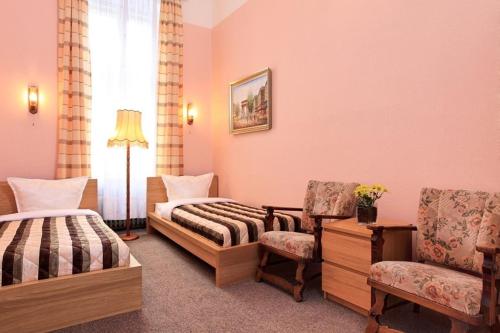 מיטה או מיטות בחדר ב-Hotel-Pension Cortina