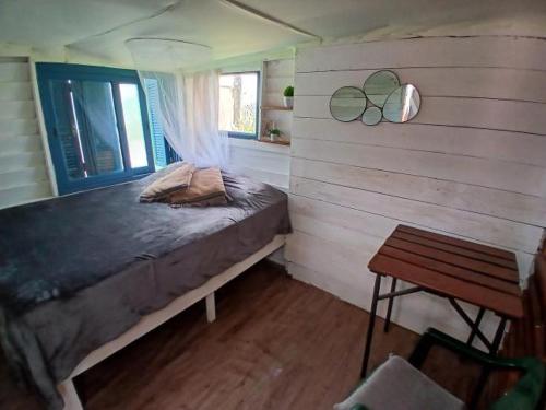 A bed or beds in a room at Green House Hostel