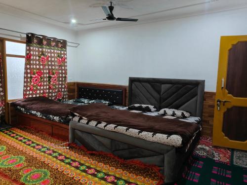 A bed or beds in a room at Reshi guest house