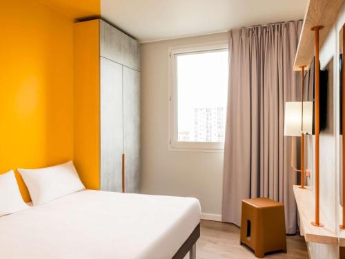 Giường trong phòng chung tại ibis budget Petropolis