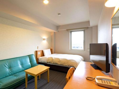 Μια τηλεόραση ή/και κέντρο ψυχαγωγίας στο Comfort Inn Kofu Showa Inter