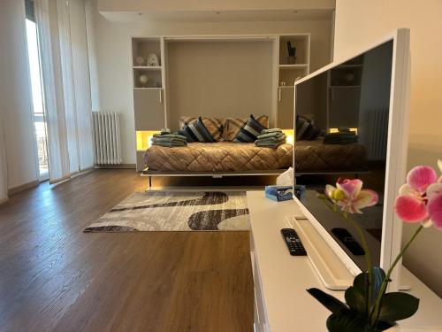 a living room with a couch and a table at Valverde Apartment and Rooms in Verona