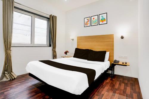 Giường trong phòng chung tại Super Townhouse PBG Mall Vashi