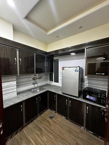 Una cocina o cocineta en Elite Guest Rooms Apartments