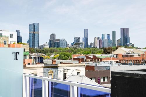 a view of the city from the roof of a building at Tyrian Serviced Apartments Fitzroy in Melbourne