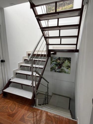 a staircase in a house with a window at Céntrico Aparta-estudio in Pereira