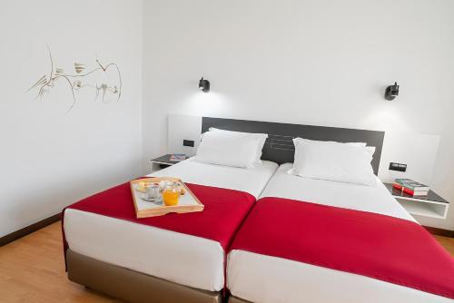 Katil atau katil-katil dalam bilik di Hotel Amadeos - Matosinhos - Porto