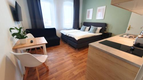 Kama o mga kama sa kuwarto sa Good Stay Aparthotel mit kostenlosen Parkplätzen