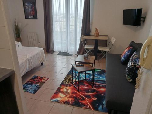 Giường trong phòng chung tại C301 Appartement Proche DisneyLand Paris