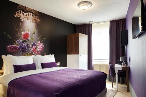 เตียงในห้องที่ The Muse Amsterdam - Boutique Hotel