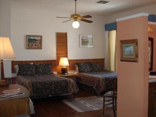 A bed or beds in a room at Lundeen Inn of the Arts