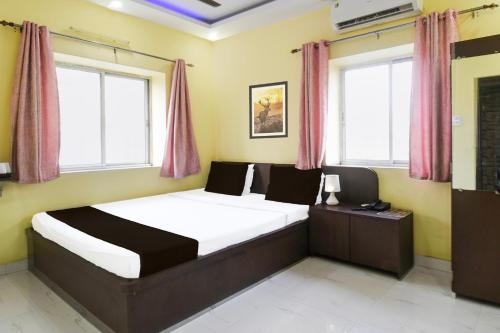 Krevet ili kreveti u jedinici u okviru objekta Super Hotel O New Town Near Kolkata Airport