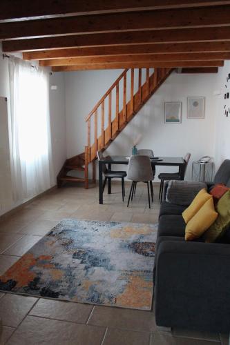 a living room with a couch and a table at Casa Giuliani in Porto Cesareo