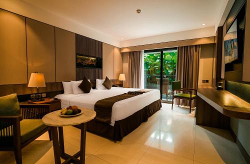 Voodi või voodid majutusasutuse The Nest Hotel Nusa Dua toas