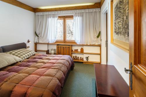 Cama ou camas em um quarto em Villa Franchetti - Stayincortina