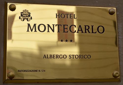 Sertifikat, penghargaan, tanda, atau dokumen yang dipajang di Hotel Montecarlo