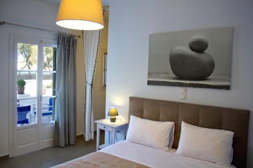 Vuode tai vuoteita majoituspaikassa Almira Suites - Seafront - Naousa Paros