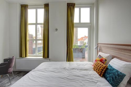 Een bed of bedden in een kamer bij Hotel Loskade 45