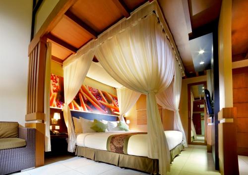 Tempat tidur dalam kamar di The Banyumas Villa