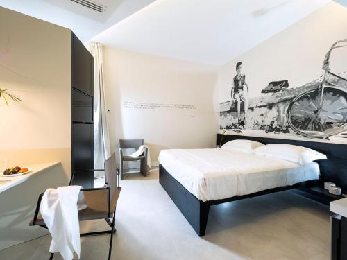 A bed or beds in a room at Duomo Suites & Spa