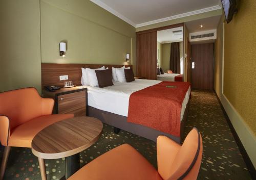 Cama ou camas em um quarto em Budget Hotel Victoria