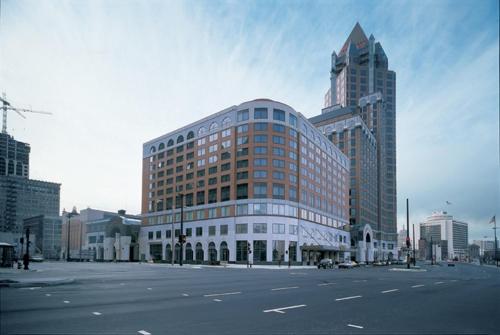 a large building on a street in a city at Saint Kate - The Arts Hotel in Milwaukee