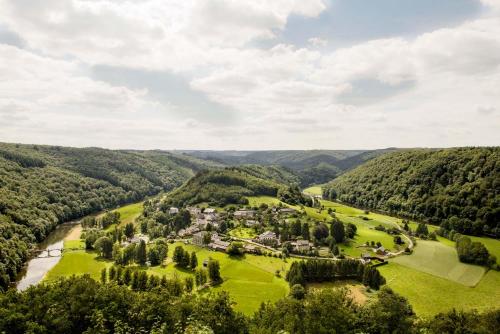 an aerial view of a village in the middle of a valley at L'orchidée in Rochehaut