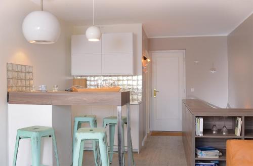 A kitchen or kitchenette at Wenningstedt Beach Apartment