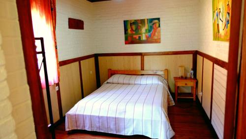 A bed or beds in a room at Eco Lodge Les Chambres Du Voyageur