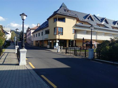 a city street with a building and a street light at Apartmá Kateřina Velké Losiny in Velké Losiny