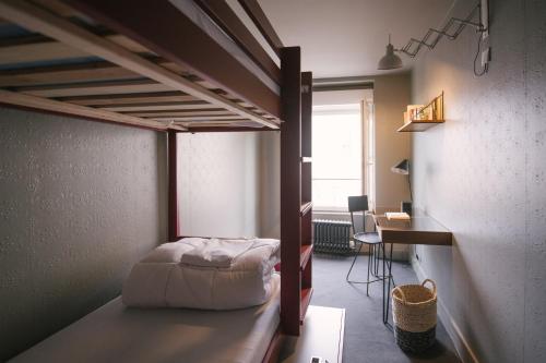 A bed or beds in a room at HO36 Hostel Lyon