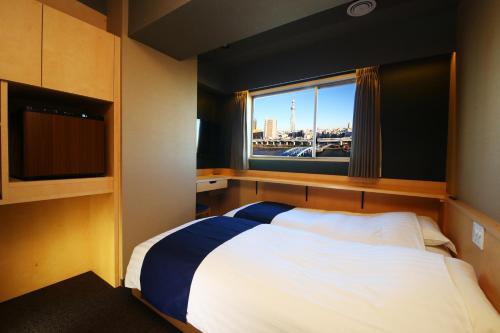 Krevet ili kreveti u jedinici u objektu Hotel Wing International Select Asakusa Komagata