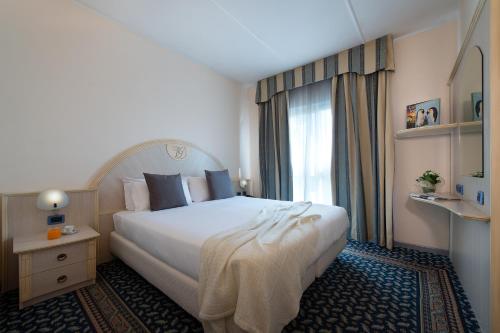 Cama ou camas em um quarto em Hotel Villa Ducale